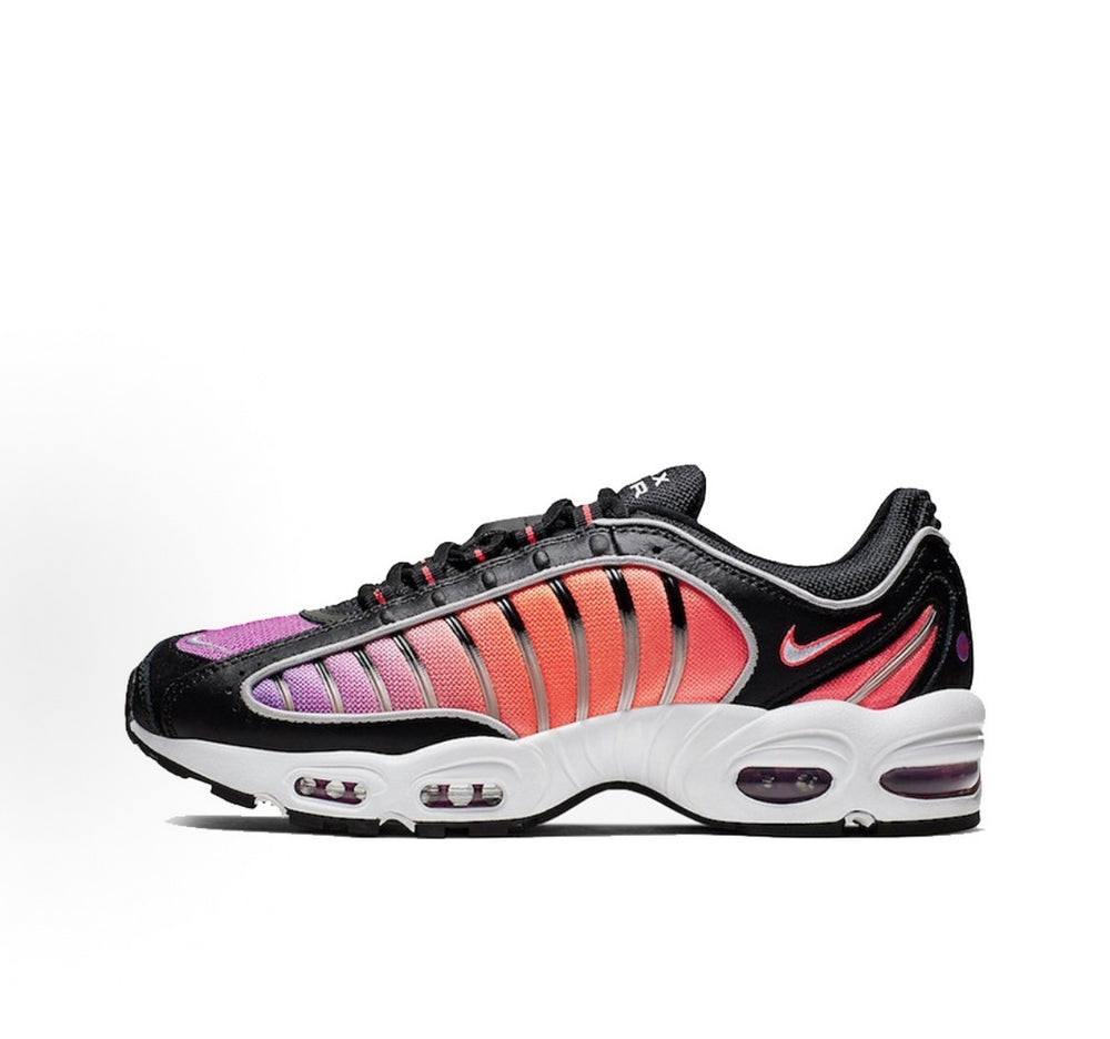 Black Nike sneakers with purple toe and red ribbed stripe panels, white air sole
