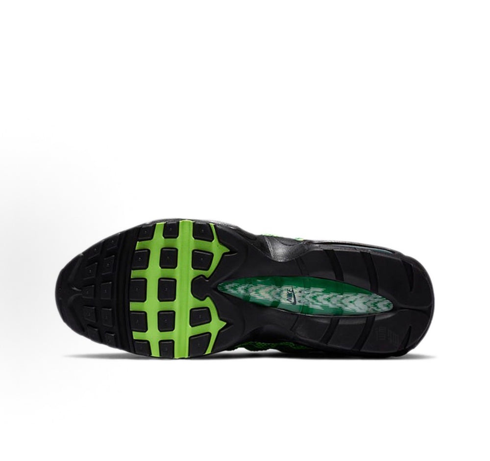 Nike Air Max 95 sneaker outsole with green traction pods and dark rubber tread