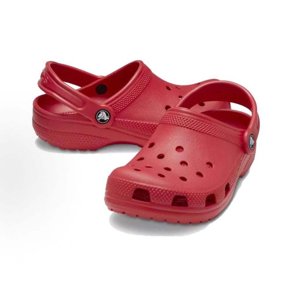 Pair of red Crocs clogs with crossover straps and perforated toe ventilation