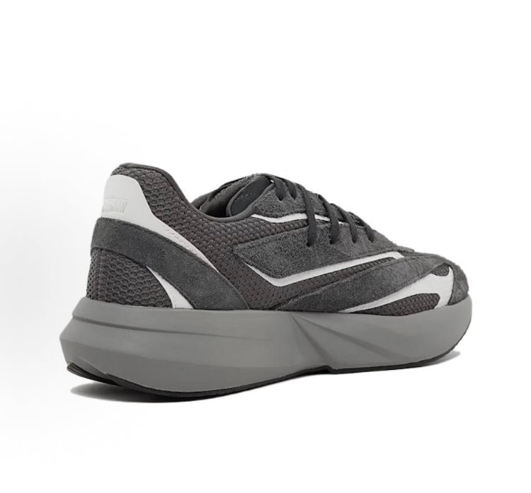 Carbon gray Adidas running shoes, side view with white stripe panel and thick midsole