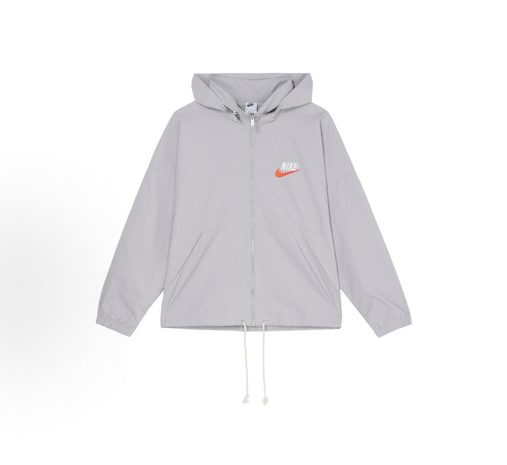 Light gray Nike hooded windbreaker jacket with full zipper, front pockets and drawstrings