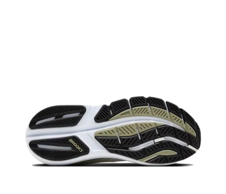 Running shoe outsole with black tread and light green pattern, white midfoot