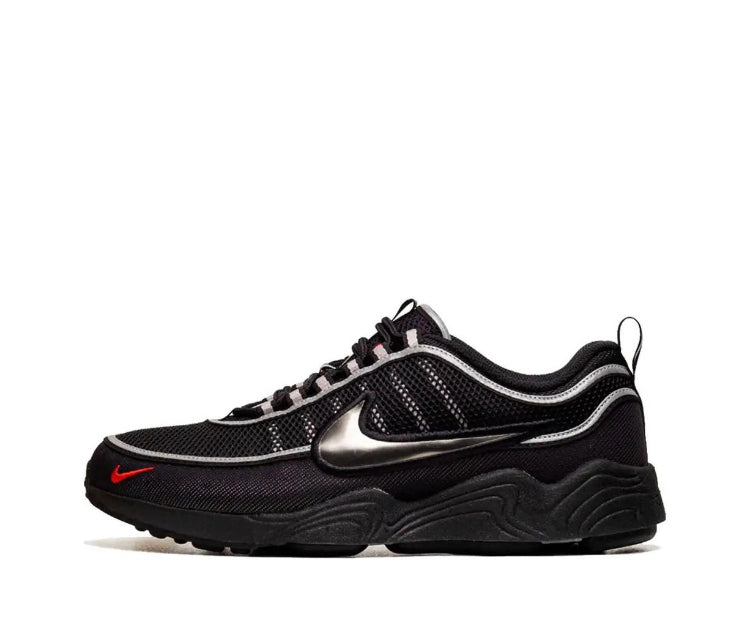 Black mesh sneaker with metallic silver swoosh and red Nike logo