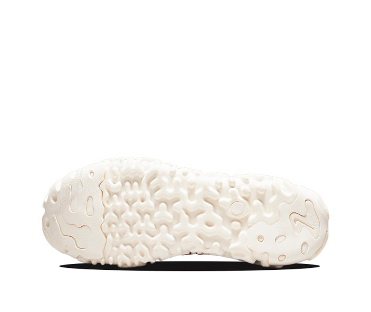 White rubber outsole with textured traction pattern, sneaker bottom view.