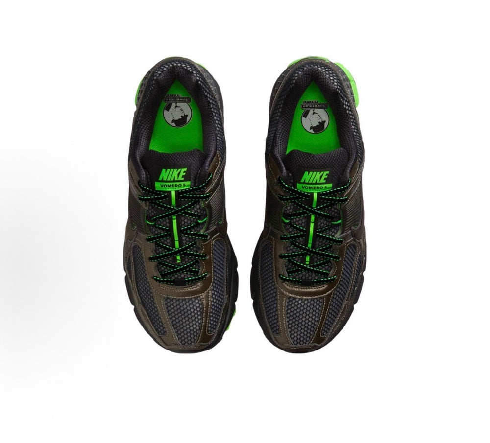 Nike Zoom Vomero 5 front view with green inner collar, black laces, and Nike logo