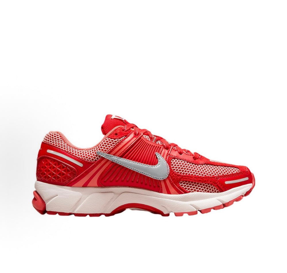 Side view of red mesh running sneakers with silver Swoosh and white sole