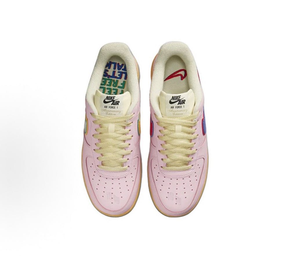 Low-top sneakers with pink leather uppers and yellow gum sole, lace-up with Nike heel