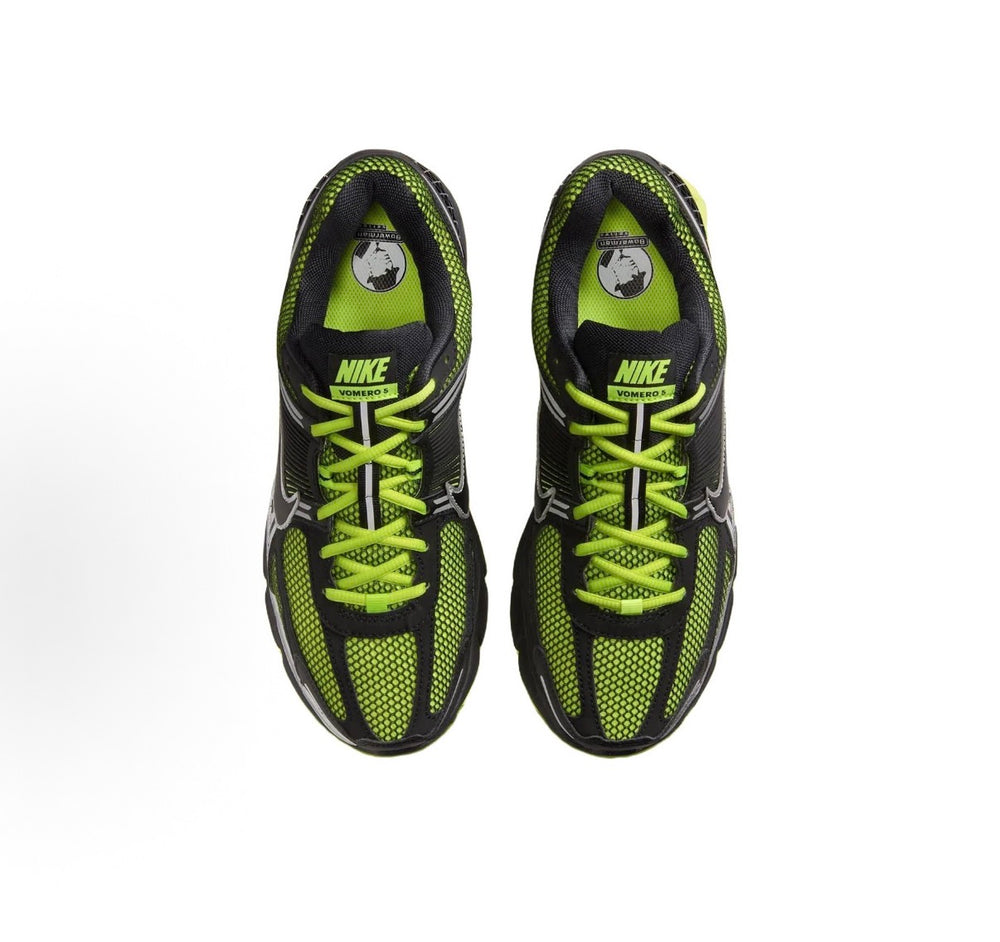 Nike Zoom Vomero 5 shoes, top view: neon green lace-up with Nike logo on tongue