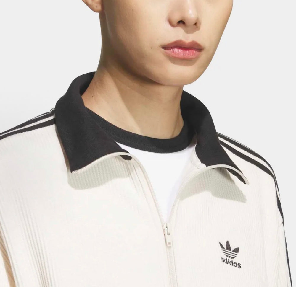 Adidas track jacket collar and front placket in white with black stripes; logo chest.