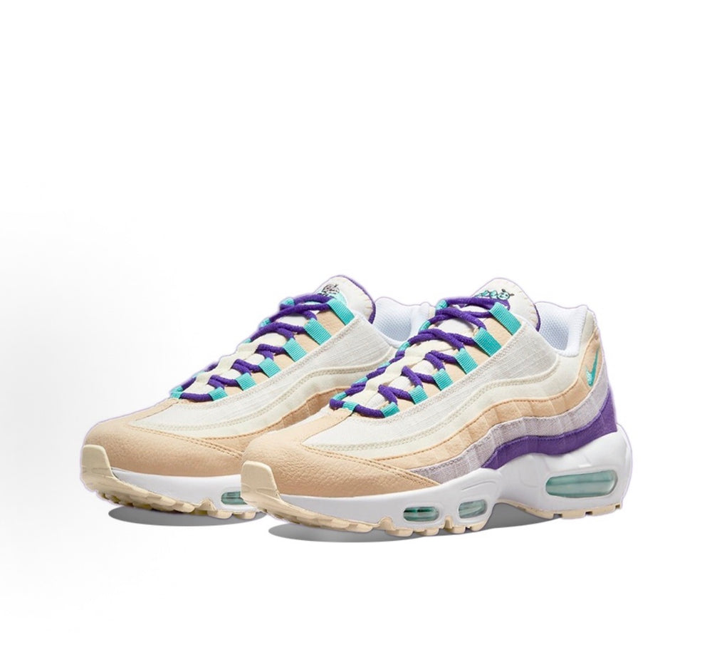 Nike Air Max 95 sneakers, side-by-side view, cream uppers with purple and teal accents