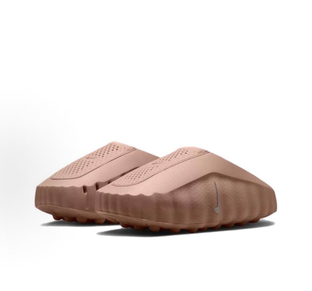 Nike slide sandal, taupe, shown from the side with textured traction outsole