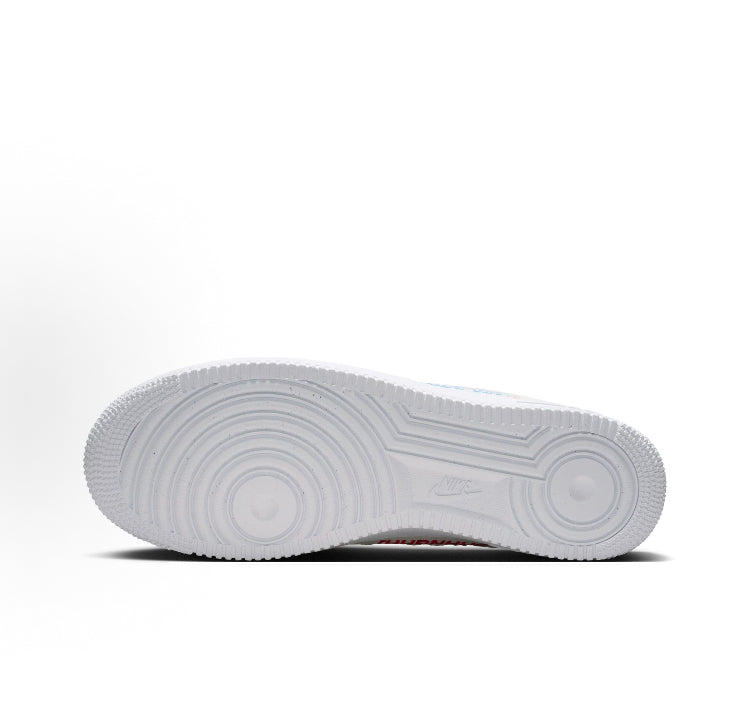 White rubber cupsole with textured tread, underside view of low-top sneakers