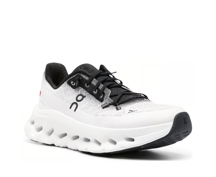 On Cloudtilt sneakers in white with black laces, black collar, and treaded sole