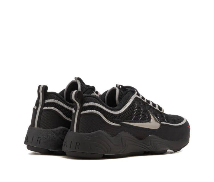 Black sneaker with metallic silver accents and Air heel panel