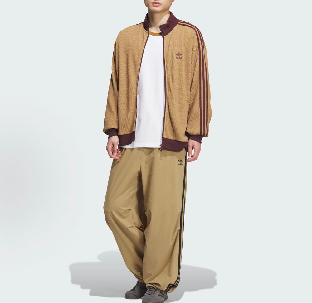 Men's Adidas track jacket and pants set in tan with maroon trim and side stripes