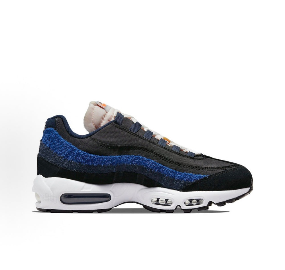 Nike Air Max 95 sneakers, dark navy/black with blue textured overlay and white midsole.