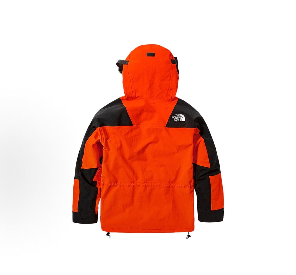 Orange-and-black hooded jacket, back view with logo patch and adjustable hood, zip front