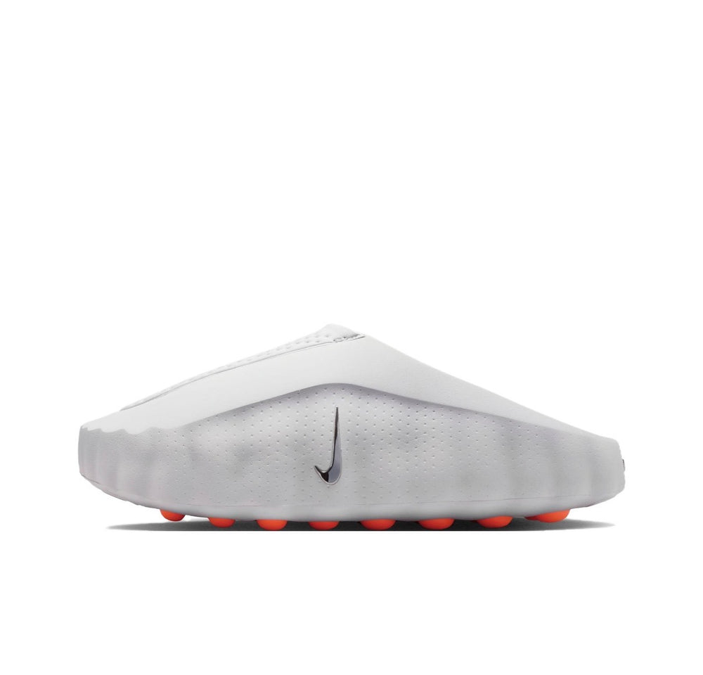 White slide sandal with Nike swoosh and orange outsole tread pods