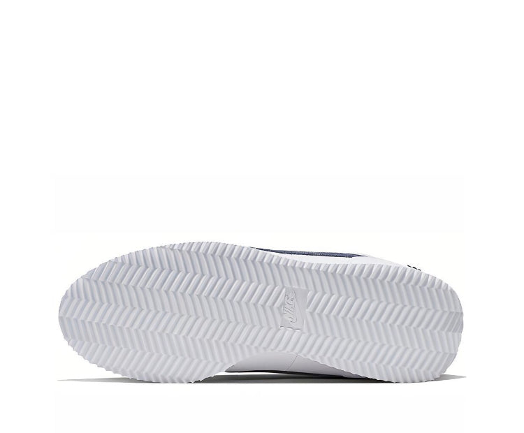 White sneaker outsole with zigzag tread and centered Nike logo