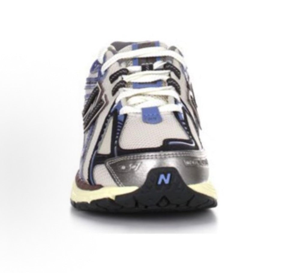New Balance 1906R heel view with blue, burgundy, and cream panels and N logo