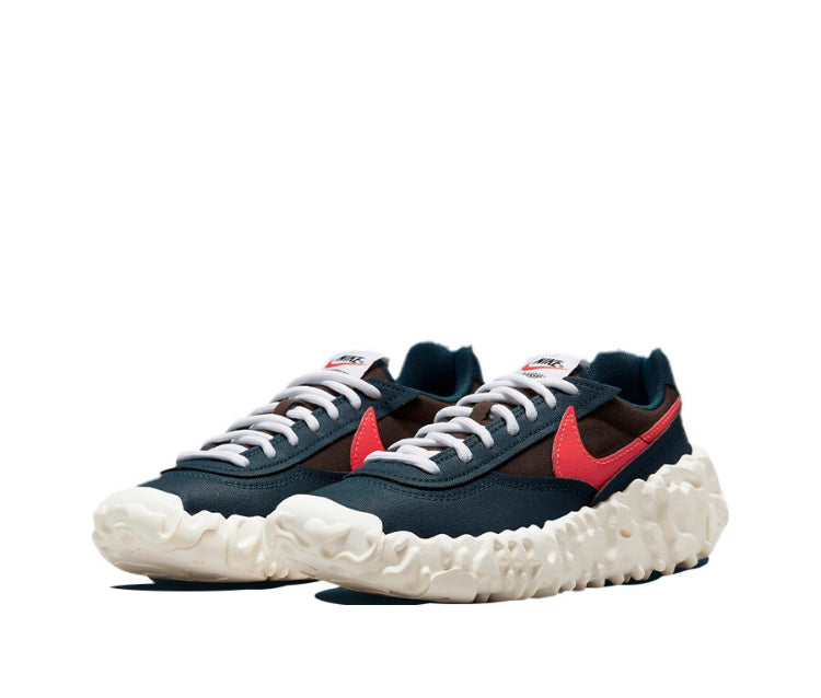 Overbreak sneakers angled front view with dark navy, red swoosh, and white laces