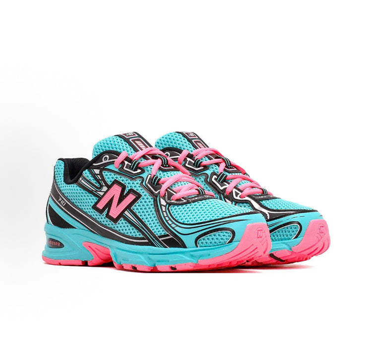 New Balance 740 teal running shoes with black stripes and pink lace-up trim