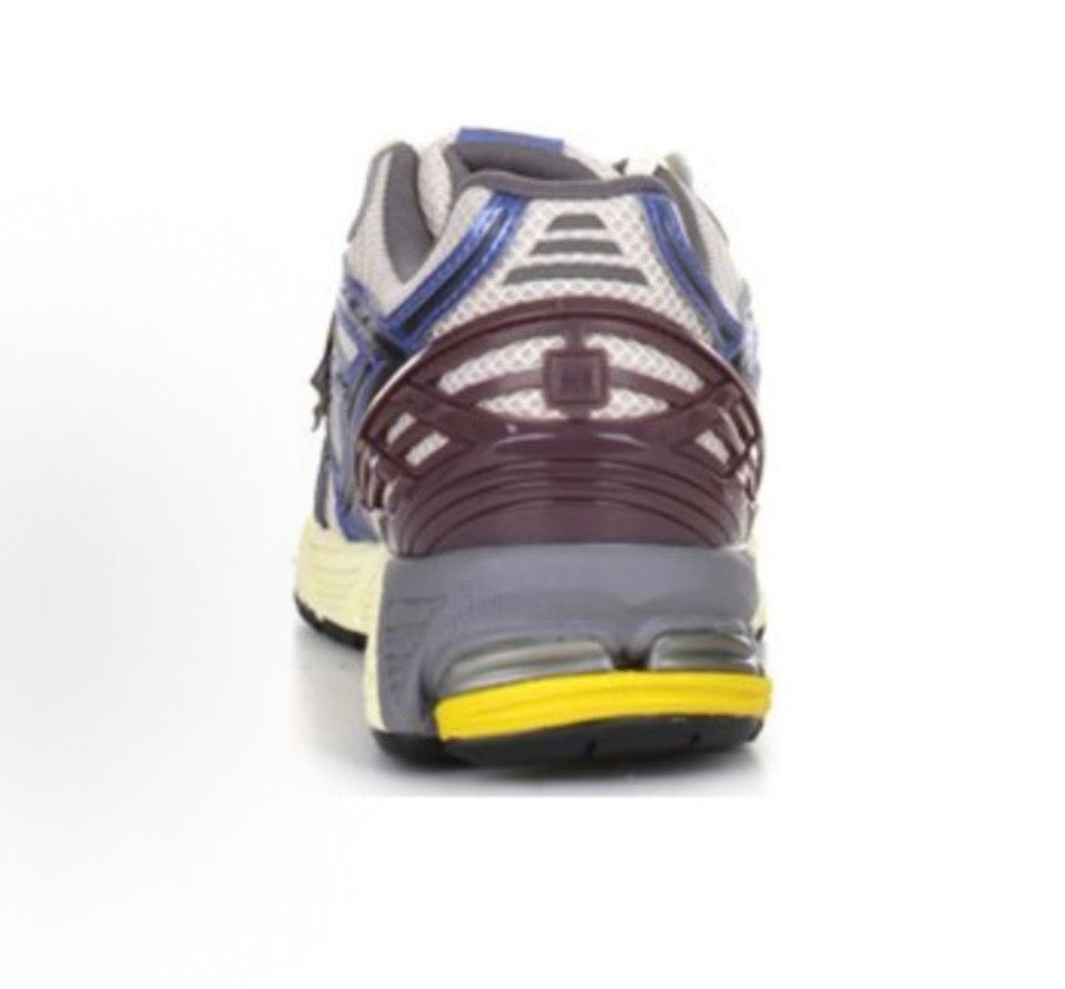 New Balance 1906R back view with burgundy heel counter, blue stripes, and yellow sole