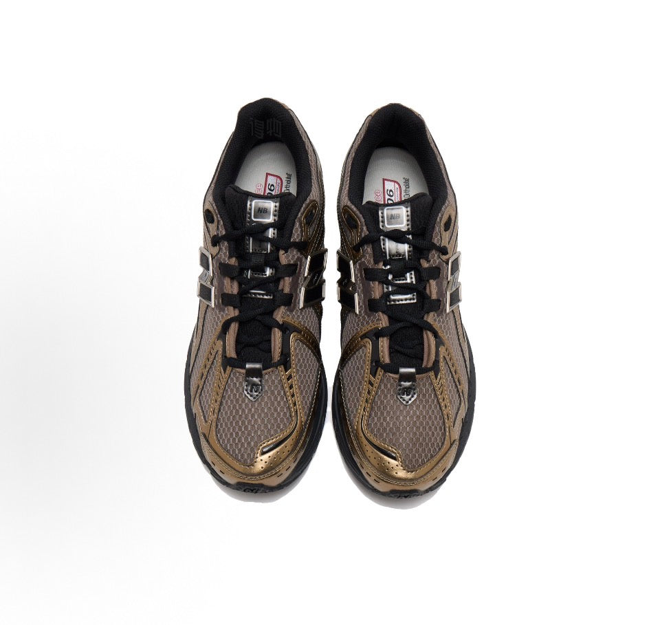 New Balance 1906R sneakers pair top view, tan mesh with black laces and logo
