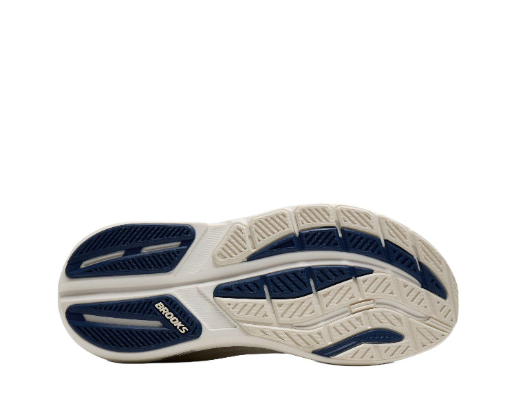 Running shoe outsole with patterned tread and blue grip zones