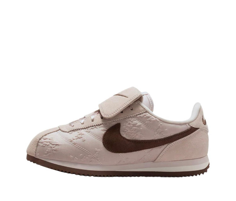Nike Cortez low-top sneakers, beige upper with dark brown Swoosh and hook strap