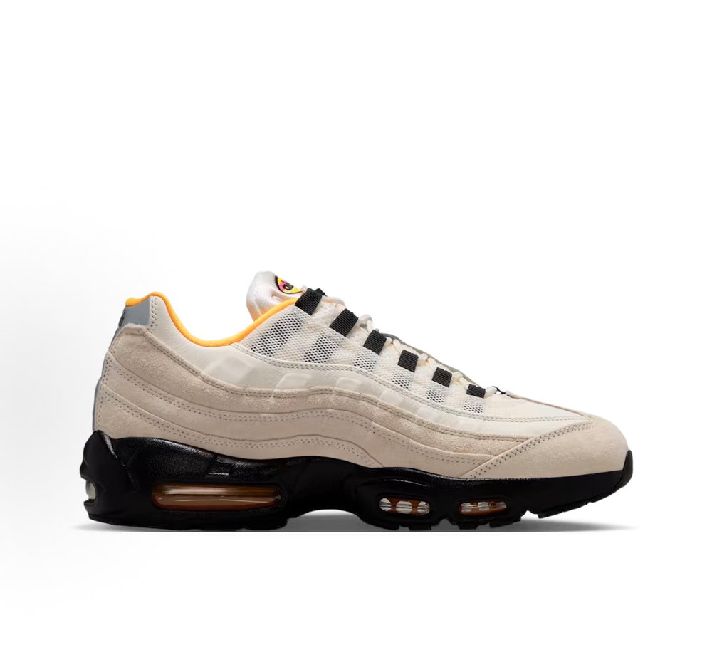 Nike Air Max 95 sneaker, beige upper with black laces and orange air unit accents