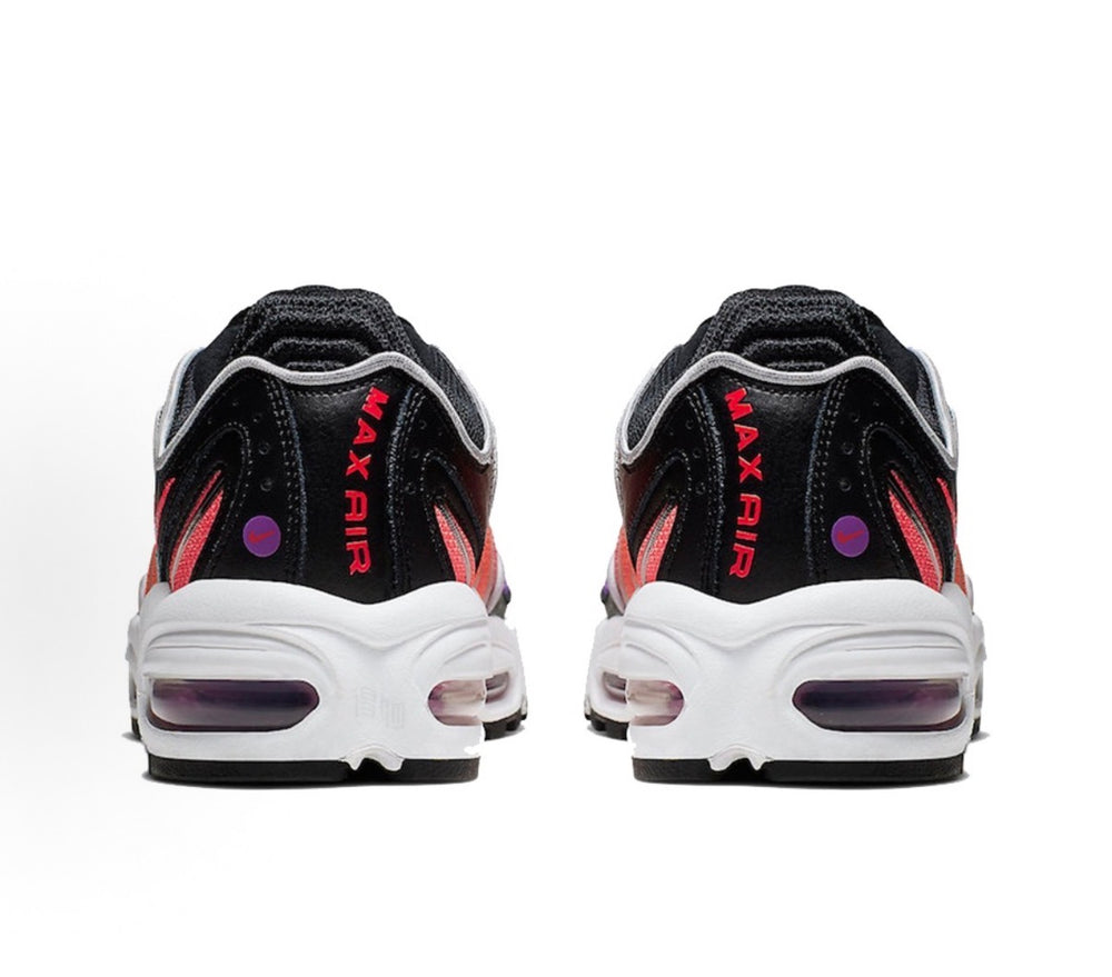Black Nike sneakers with white heel cushioning and red 'MAX AIR' text on back