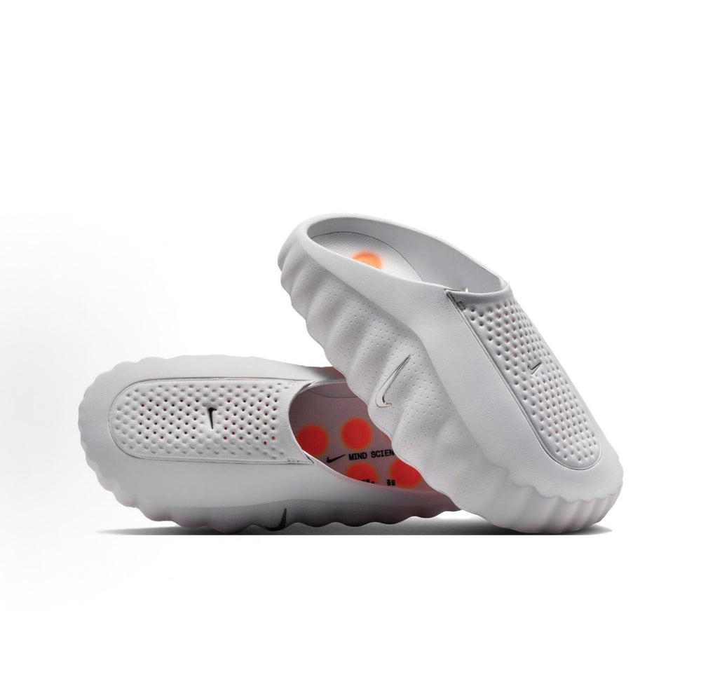 White slide sandal with Nike swoosh logo and perforated side footbed