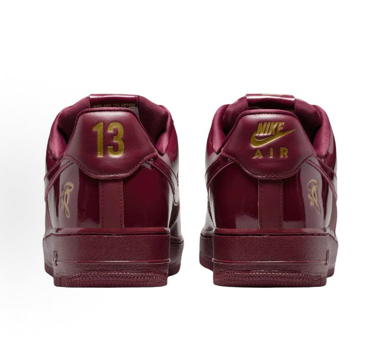 Dark maroon Air Force 1 low-top sneakers with heel tabs and '13' size marking