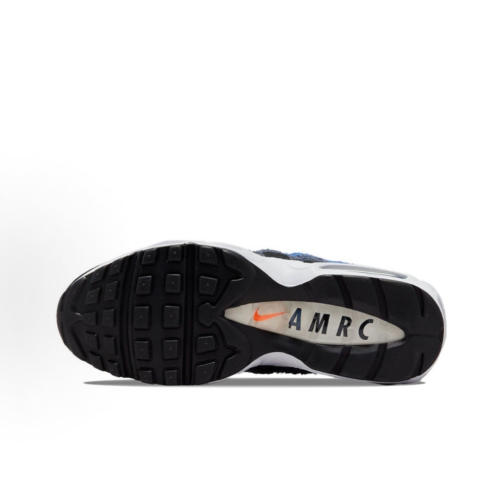Nike Air Max 95 sneakers, visible tread outsole with AMRC logo on dark rubber base.