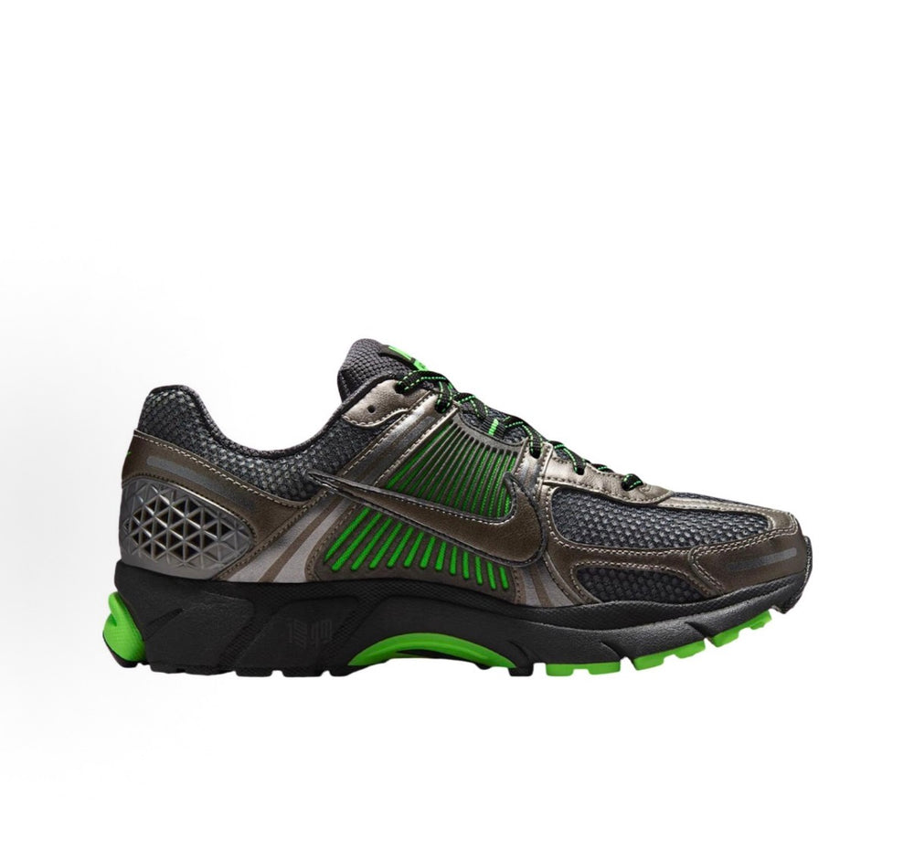 Nike Zoom Vomero 5 running shoes in dark gray with green stripe accents and black outsole