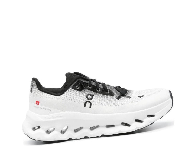 On Cloudtilt running shoes, white upper with black accents and white midsole