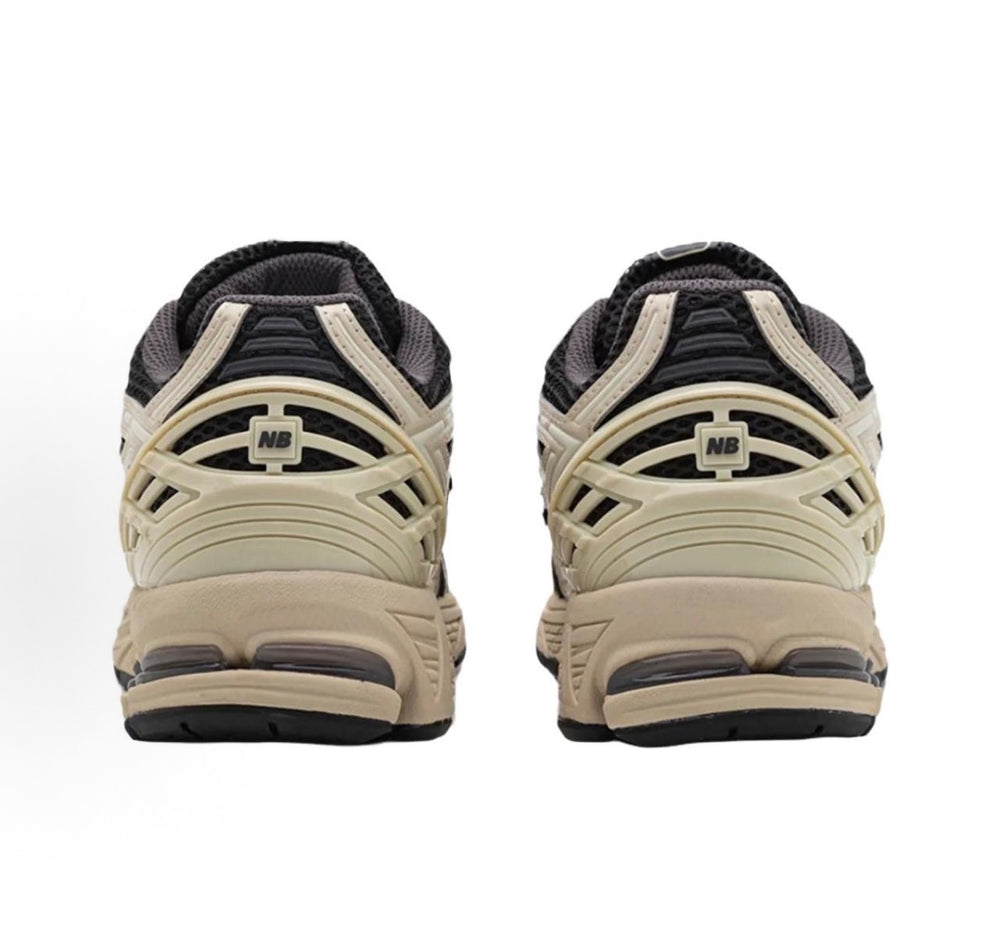 New Balance sneakers heel view with cushioned back and NB logo patch