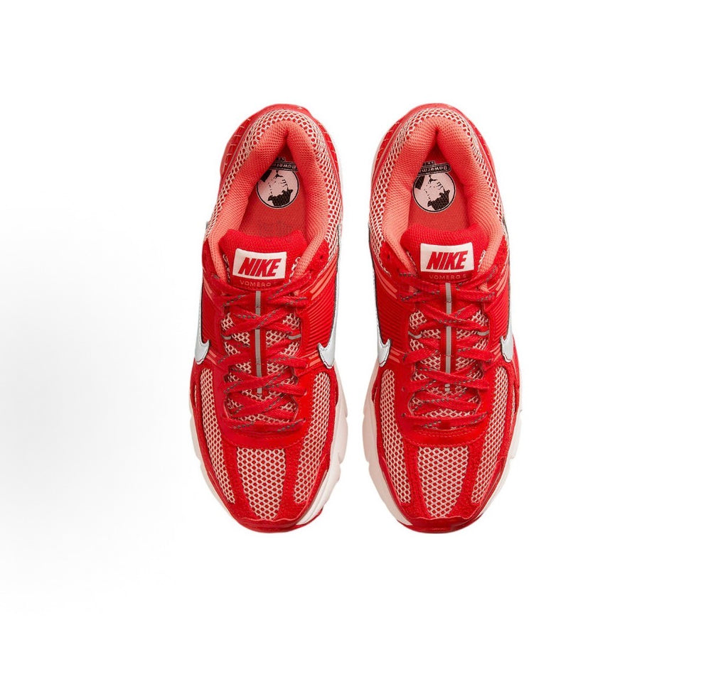 Pair of red Nike running shoes, front view with laced mesh upper