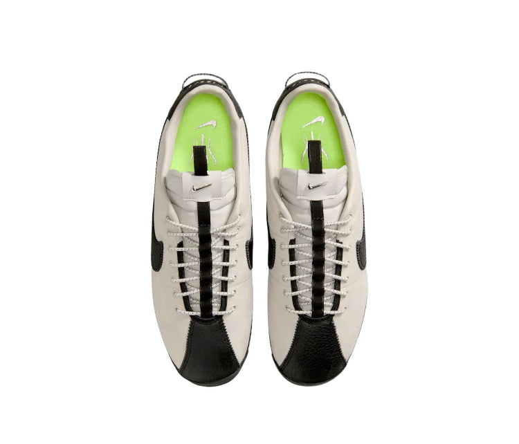 Cortez sneakers top view, cream uppers with black panels and lime-green sockliner