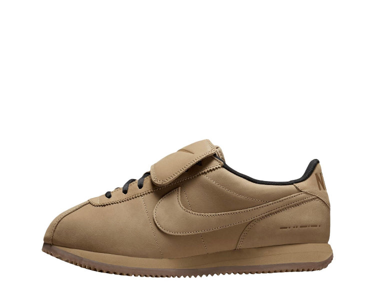 Cortez sneakers, beige side with black laces, swoosh, and gum-brown outsole