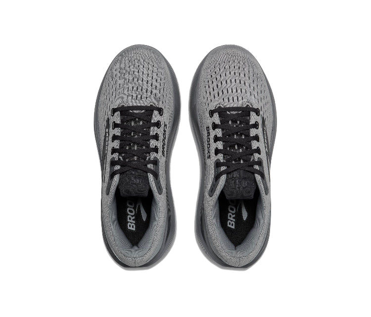 Pair of gray running shoes with black laces and Brooks text on tongue
