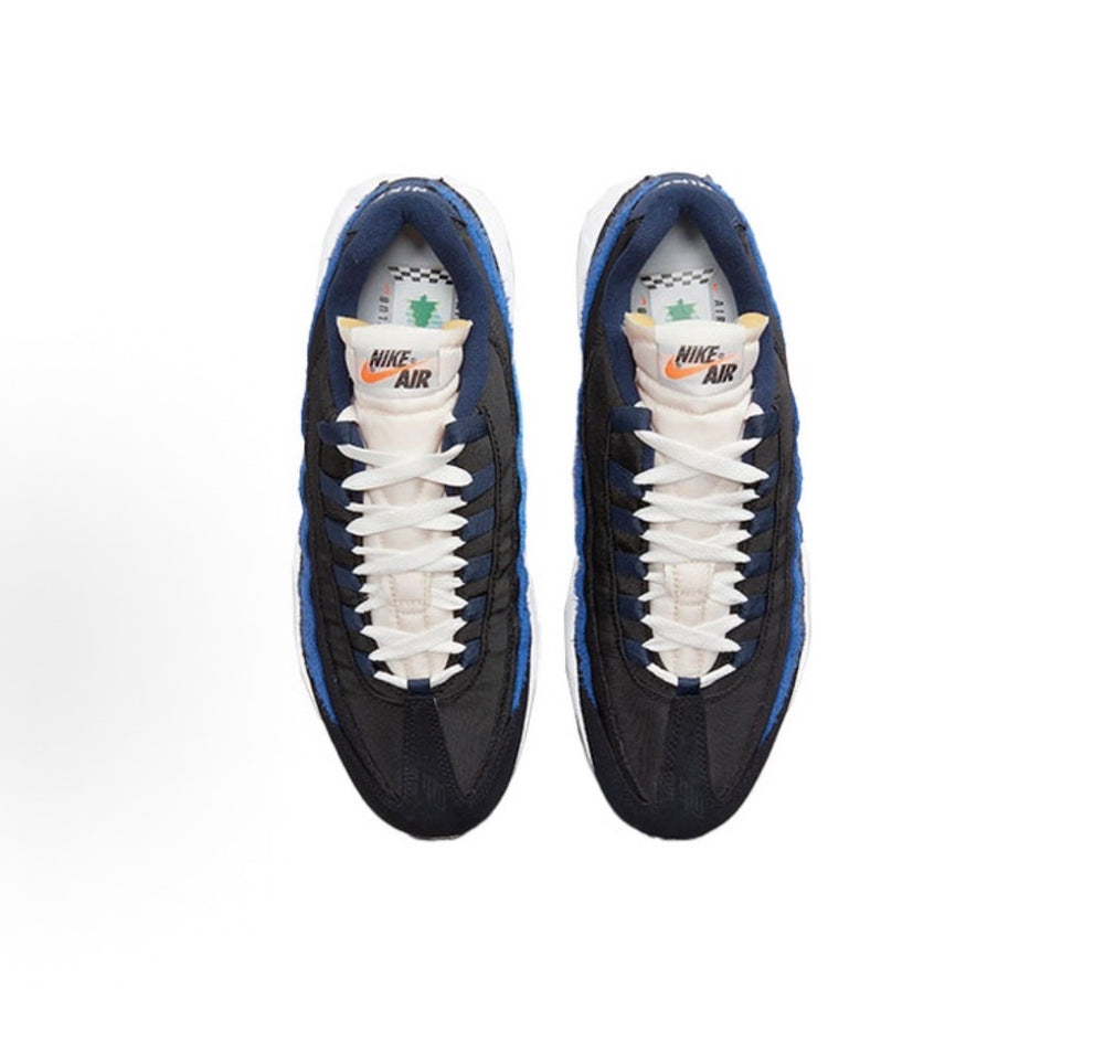 Nike Air Max 95 sneakers, black/navy with white laces and visible Nike Air tongue labels.