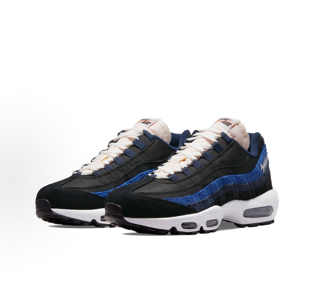 Nike Air Max 95 sneakers, black with blue suede panels and white Air sole, lace-up.