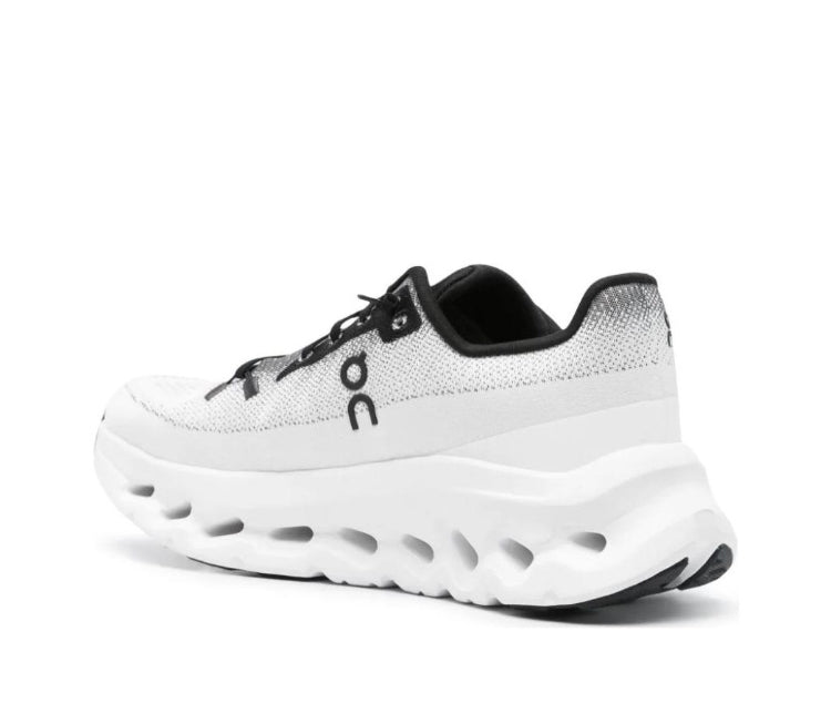 On Cloudtilt sneakers, white knit upper with black logo and cushioned sole