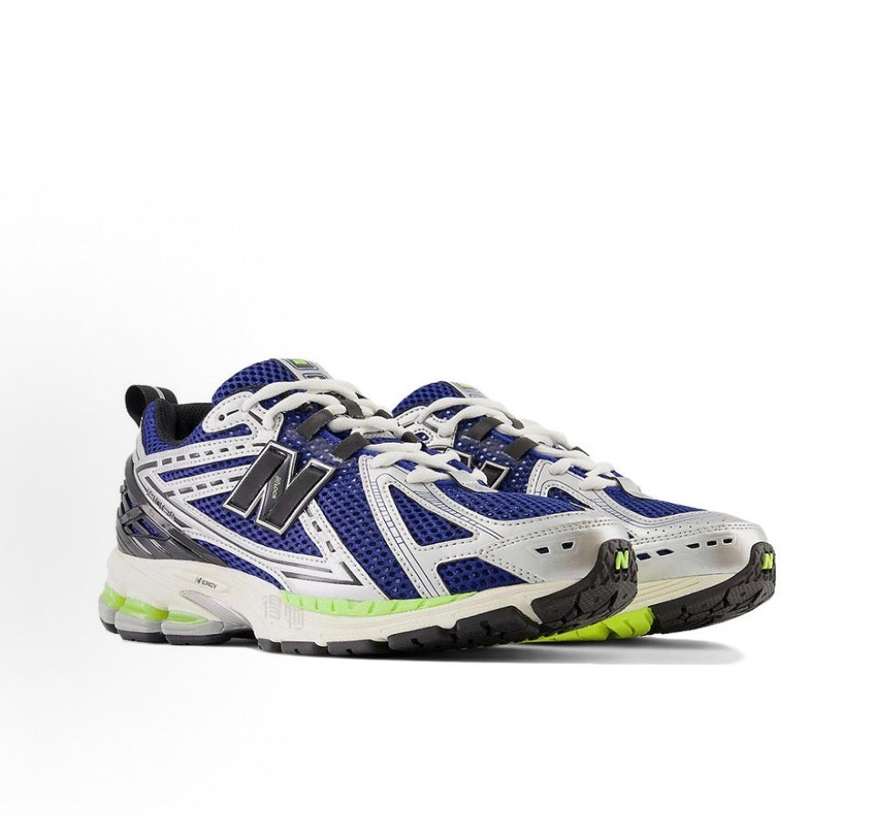 Blue and white low-top running sneakers with N logo and neon green accents
