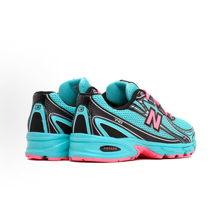 New Balance 740 teal sneakers with black overlays, pink laces, ABZORB heel