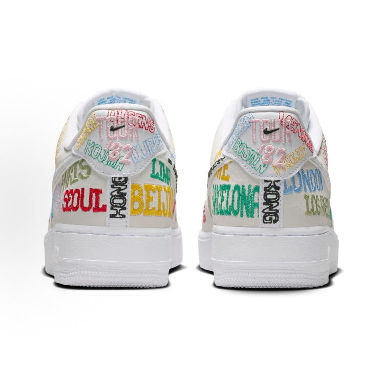Back view of low-top sneakers with beige uppers and multicolor printed details