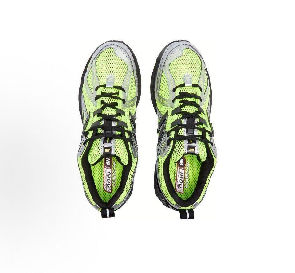 New Balance 1906R sneakers, neon green mesh uppers with black laces and grey trim
