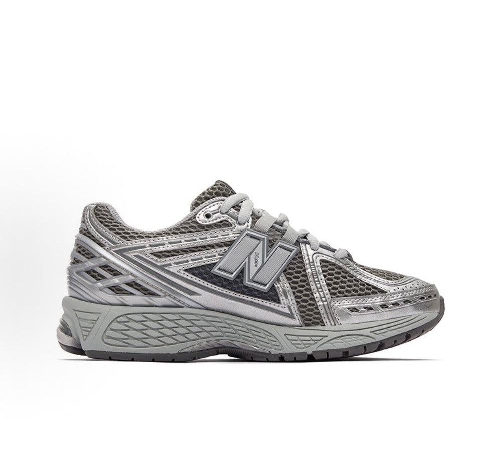 New Balance 1906R lace-up running shoes, gray mesh with silver N logo and paneling.